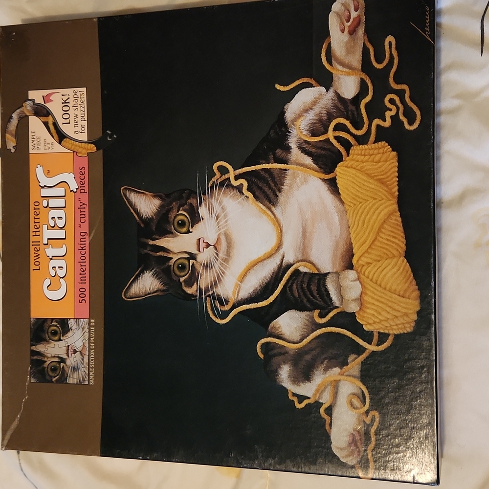 Two puzzles new never opened, both 500 pieces